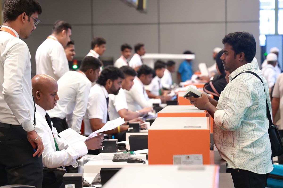 Image: Travelers checking in at the Chennai Airport.