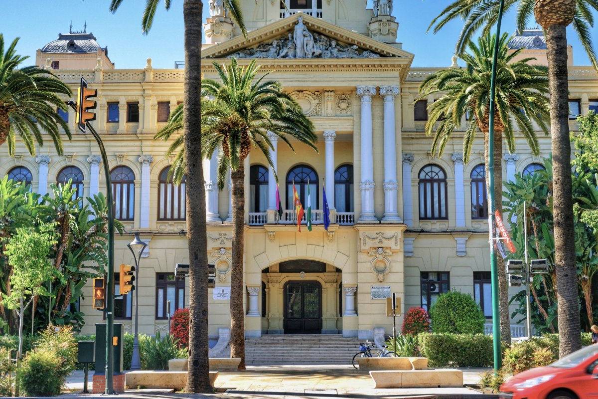 Building with multiple flags in Malaga, Spain