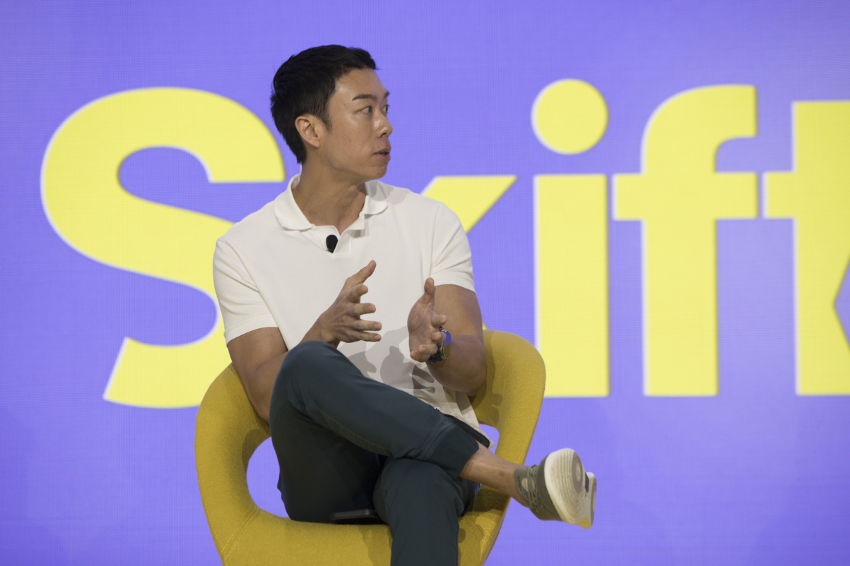 Eric Gnock Fah, President and Co-Founder of Klook, speaking on-stage at Skift Global Forum 2024 in New York.