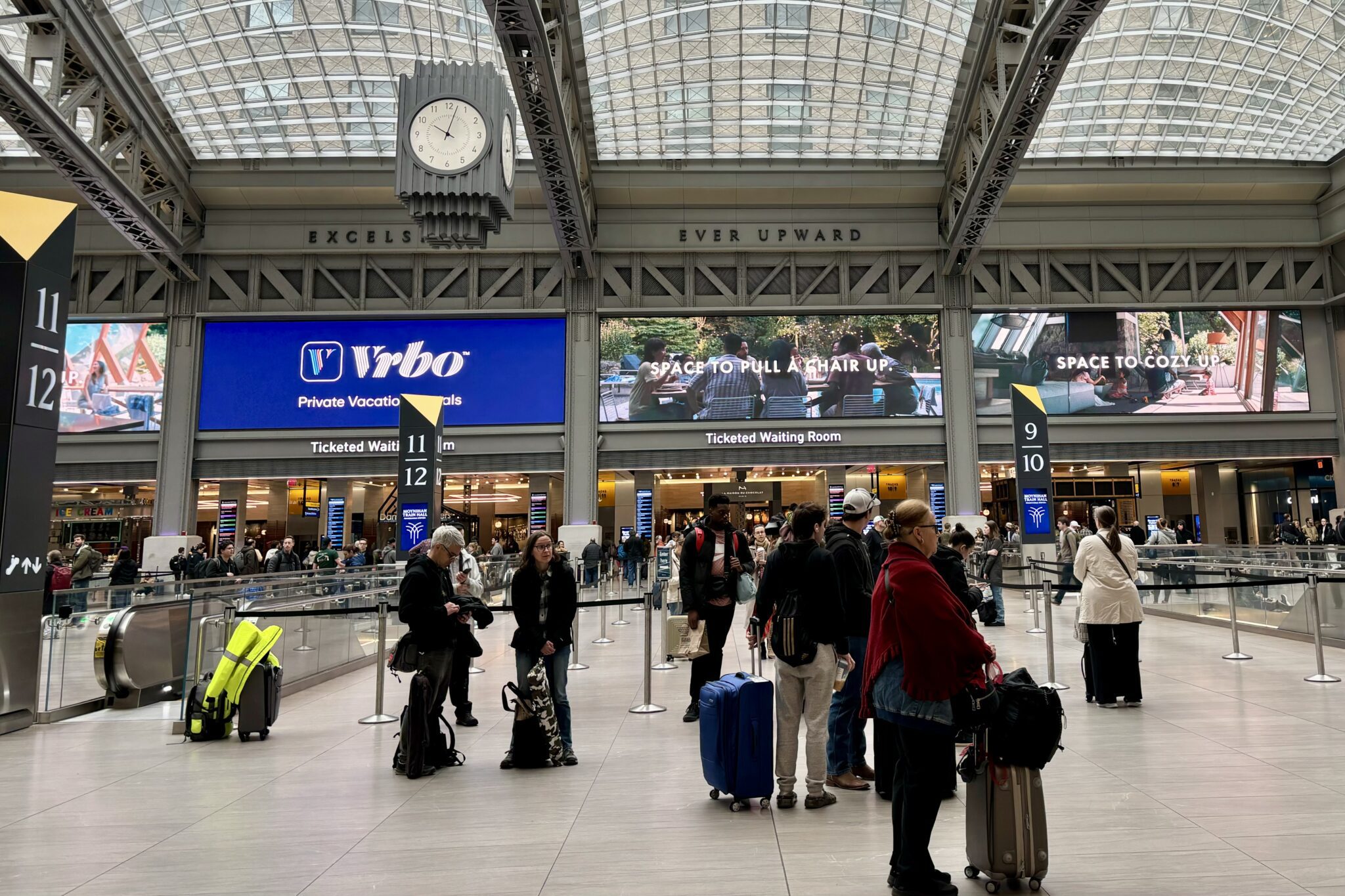 An advertisement for short-term rental service Vrbo at Moynihan Train Hall in New York City.  