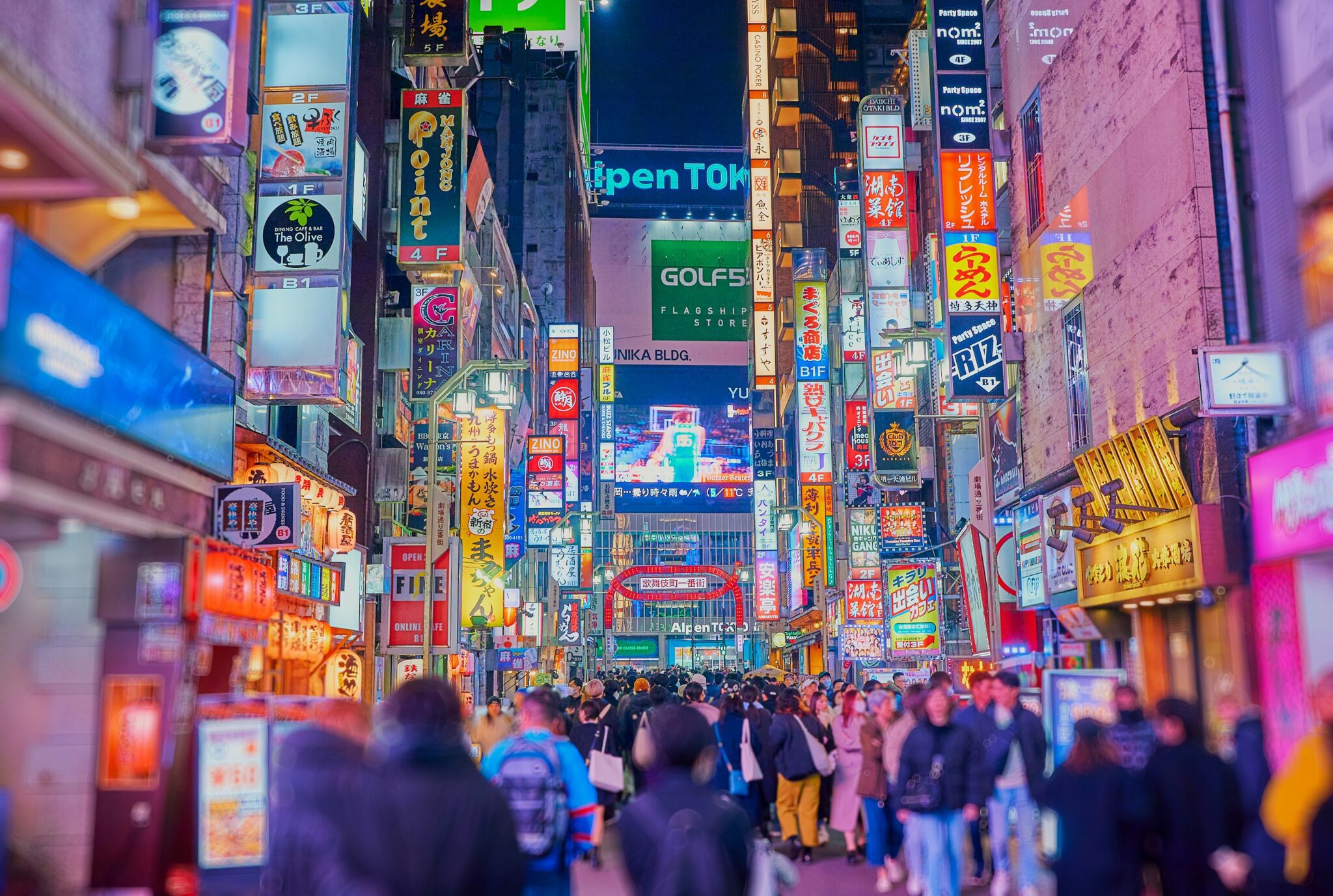 A busy street in Tokyo at night.